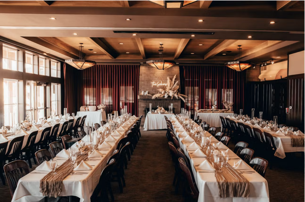 Elegant reception setup at one of the most charming Oregon Coast wedding venues, featuring long banquet tables and warm lighting.